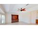 Bright living room featuring tile floors, windows, and a wooden built-in entertainment center at 399 Bal Harbor Blvd, Punta Gorda, FL 33950