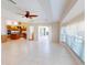 Bright living room open to kitchen features tile floors and access to outdoor living space at 399 Bal Harbor Blvd, Punta Gorda, FL 33950