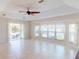 Living room overlooking pool features tile floors and a sliding glass door to outdoor living at 399 Bal Harbor Blvd, Punta Gorda, FL 33950