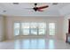 Light-filled living room featuring tile floors, large windows, and view of the water at 399 Bal Harbor Blvd, Punta Gorda, FL 33950