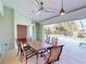 Inviting screened patio boasts a ceiling fan and relaxing views of the private pool at 399 Bal Harbor Blvd, Punta Gorda, FL 33950