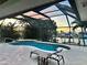 Inviting screened-in pool area with comfortable seating, ideal for relaxation and enjoying waterfront views at 399 Bal Harbor Blvd, Punta Gorda, FL 33950