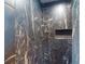 Shower featuring marble style tile and a built-in shelf at 399 Bal Harbor Blvd, Punta Gorda, FL 33950