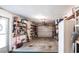 Spacious garage with ample storage, shelving, and garage door access at 4051 Rock Creek Dr, Port Charlotte, FL 33948