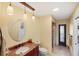 Bathroom featuring a sink with granite counters, wooden cabinet, and decorative pendant lighting at 611 Bal Harbor Blvd, Punta Gorda, FL 33950