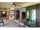 Inviting covered patio with bar seating, ceiling fans, and a view to interior at 611 Bal Harbor Blvd, Punta Gorda, FL 33950