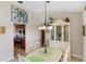 Bright dining room with a decorative hutch, and an open view into the adjacent kitchen space at 611 Bal Harbor Blvd, Punta Gorda, FL 33950