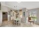 Inviting dining room featuring a classic china cabinet, large window, and neutral decor at 611 Bal Harbor Blvd, Punta Gorda, FL 33950