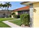 Well-maintained front yard highlighting vibrant green grass and neatly trimmed shrubs at 611 Bal Harbor Blvd, Punta Gorda, FL 33950