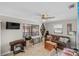 Bright living room with tile floors, large windows, and comfortable furnishings at 611 Bal Harbor Blvd, Punta Gorda, FL 33950