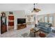 Open-concept living room showcasing tile flooring, and a seamless transition to the adjacent dining area at 611 Bal Harbor Blvd, Punta Gorda, FL 33950