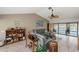 Comfortable living room with vaulted ceiling, tile floors, and serene water views at 611 Bal Harbor Blvd, Punta Gorda, FL 33950
