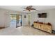 Bright main bedroom featuring a large sliding glass door leading to the pool area at 611 Bal Harbor Blvd, Punta Gorda, FL 33950