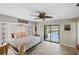 Bright main bedroom with large windows and sliding door access to the outdoor pool at 611 Bal Harbor Blvd, Punta Gorda, FL 33950