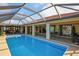 Beautiful screened-in pool, patio, and home overlooking the canal at 611 Bal Harbor Blvd, Punta Gorda, FL 33950