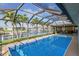 Beautiful screened-in pool overlooking the canal and lush landscaping at 611 Bal Harbor Blvd, Punta Gorda, FL 33950