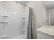 Shower stall with built-in shelving, shower curtain, and vanity with sink at 616 Posadas Cir, Punta Gorda, FL 33983