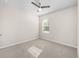 Bedroom with a window and neutral walls, carpet, and ceiling fan at 616 Posadas Cir, Punta Gorda, FL 33983