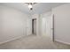 Neutral bedroom with carpet flooring, a ceiling fan, and a view of a closet at 616 Posadas Cir, Punta Gorda, FL 33983
