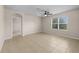 Bright bedroom featuring a ceiling fan and window with backyard view at 616 Posadas Cir, Punta Gorda, FL 33983