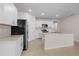 View of the kitchen featuring white cabinets, stainless steel appliances, and tile floors at 616 Posadas Cir, Punta Gorda, FL 33983