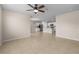 Open living area with views into kitchen with stainless appliances and island seating at 616 Posadas Cir, Punta Gorda, FL 33983