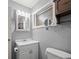 Bathroom featuring white sink, mirror, and a medicine cabinet with lighting above at 8035 Hillman Ave, Punta Gorda, FL 33982