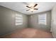 Cozy bedroom features neutral walls, built-in shelving, and a window providing natural light at 8035 Hillman Ave, Punta Gorda, FL 33982
