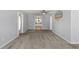 Bright living room with neutral walls, plush carpet, ceiling fan, and an inviting open floor plan at 8035 Hillman Ave, Punta Gorda, FL 33982