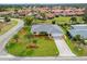Aerial view of a single-Gathering home showing manicured lawn and long driveway at 916 S Gondola Dr, Venice, FL 34293
