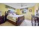 Main bedroom features elegant wooden furniture, plush carpeting, and bright natural light at 916 S Gondola Dr, Venice, FL 34293