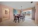 Inviting dining area with stylish chandelier and access to outdoor space at 916 S Gondola Dr, Venice, FL 34293