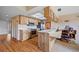 Charming kitchen with wood cabinets, modern stainless steel appliances, and an adjacent eat-in space at 916 S Gondola Dr, Venice, FL 34293