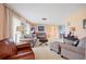 Cozy living room with plush seating and plenty of natural light at 916 S Gondola Dr, Venice, FL 34293
