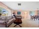 Bright and airy living room combining dining and seating areas at 916 S Gondola Dr, Venice, FL 34293