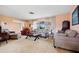 Comfortable living room with views of the outdoor area through large windows at 916 S Gondola Dr, Venice, FL 34293