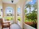Relaxing screened patio with views of the lush yard at 916 S Gondola Dr, Venice, FL 34293