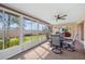 Comfortable sunroom with sliding doors to the yard and easy access to the indoor living room at 916 S Gondola Dr, Venice, FL 34293