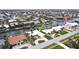 Aerial view of a canal-front neighborhood with lush landscaping and private boat docks at 931 Bal Harbor Blvd, Punta Gorda, FL 33950