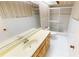 Bright bathroom featuring a single sink vanity, toilet, and sliding glass door shower at 931 Bal Harbor Blvd, Punta Gorda, FL 33950