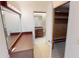 En suite bathroom with large mirror, vanity, and walk-in closet at 931 Bal Harbor Blvd, Punta Gorda, FL 33950