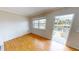 Bright bedroom with hardwood floors, large window with views of the canal, and direct access to the lanai at 931 Bal Harbor Blvd, Punta Gorda, FL 33950