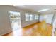 Bedroom with hardwood floors, canal view and a door leading to the outside at 931 Bal Harbor Blvd, Punta Gorda, FL 33950