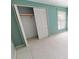 Bedroom with a white closet and a window providing natural light at 931 Bal Harbor Blvd, Punta Gorda, FL 33950