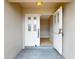 Bright entryway with a decorative glass front door and neutral tiled flooring at 931 Bal Harbor Blvd, Punta Gorda, FL 33950