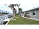 Waterfront home with a private boat dock, lush landscaping, and stunning canal views at 931 Bal Harbor Blvd, Punta Gorda, FL 33950