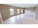 Spacious living room featuring large windows, neutral walls, and tiled flooring at 931 Bal Harbor Blvd, Punta Gorda, FL 33950
