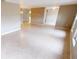 Expansive living space featuring neutral walls, tiled flooring, and access to other rooms at 931 Bal Harbor Blvd, Punta Gorda, FL 33950