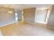 Open living area featuring neutral walls, tiled flooring, and stylish lighting fixtures at 931 Bal Harbor Blvd, Punta Gorda, FL 33950