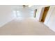 Spacious main bedroom with neutral carpet and large windows to allow for natural light at 931 Bal Harbor Blvd, Punta Gorda, FL 33950